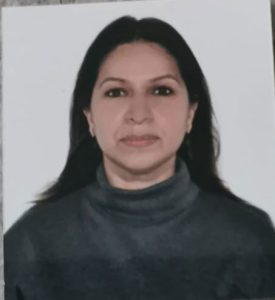 a woman with long hair wearing a turtleneck