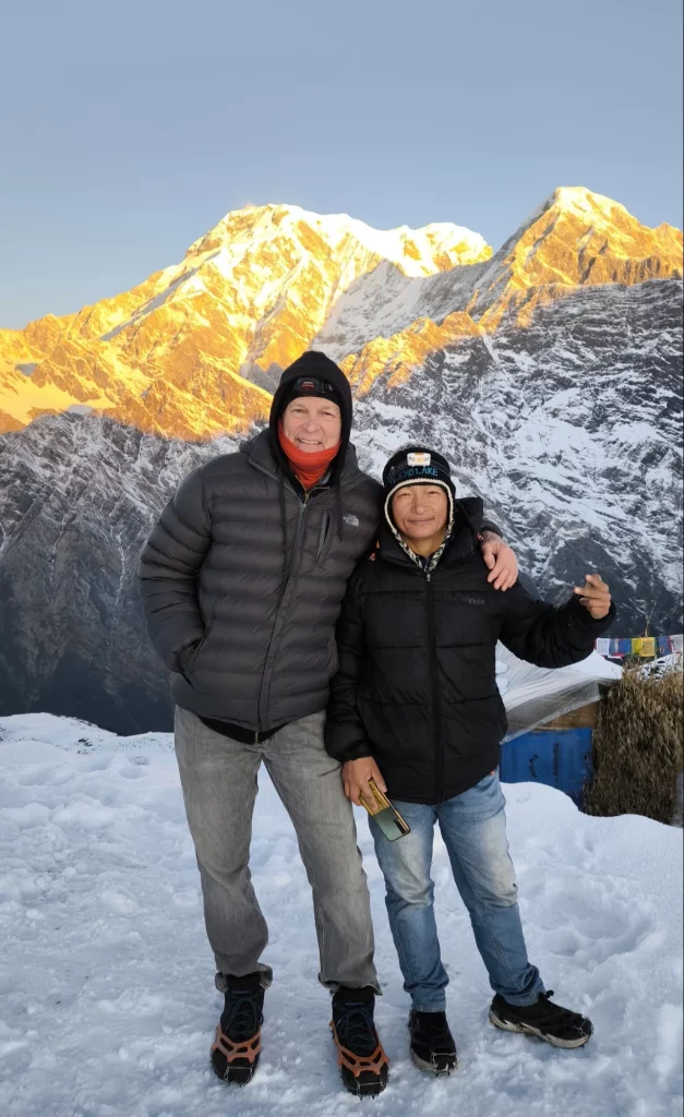two people standing in the snow
